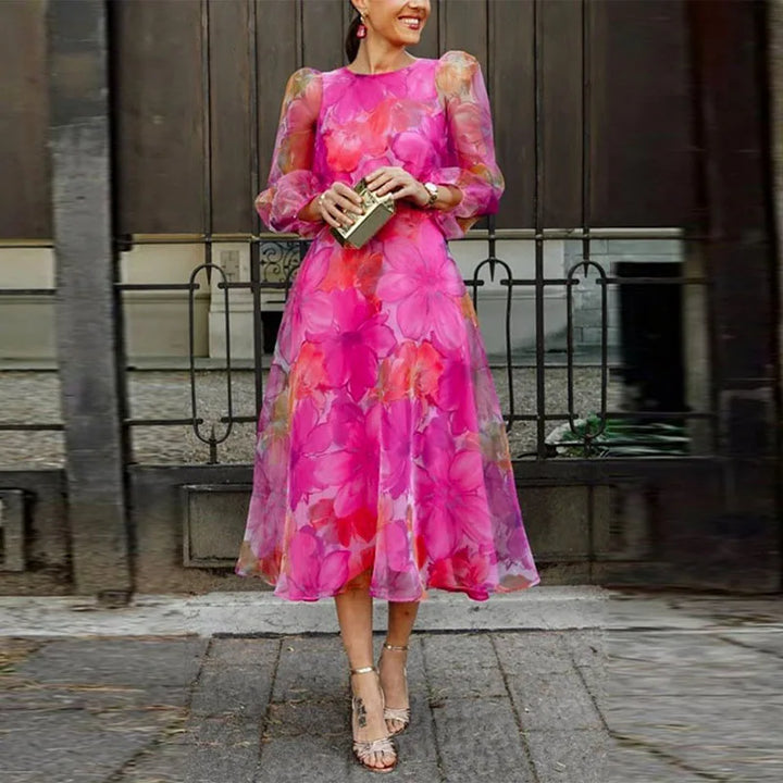 Elegant women's floral midi dress with long sleeves, perfect for a wedding guest or formal party. Special occasion wear.