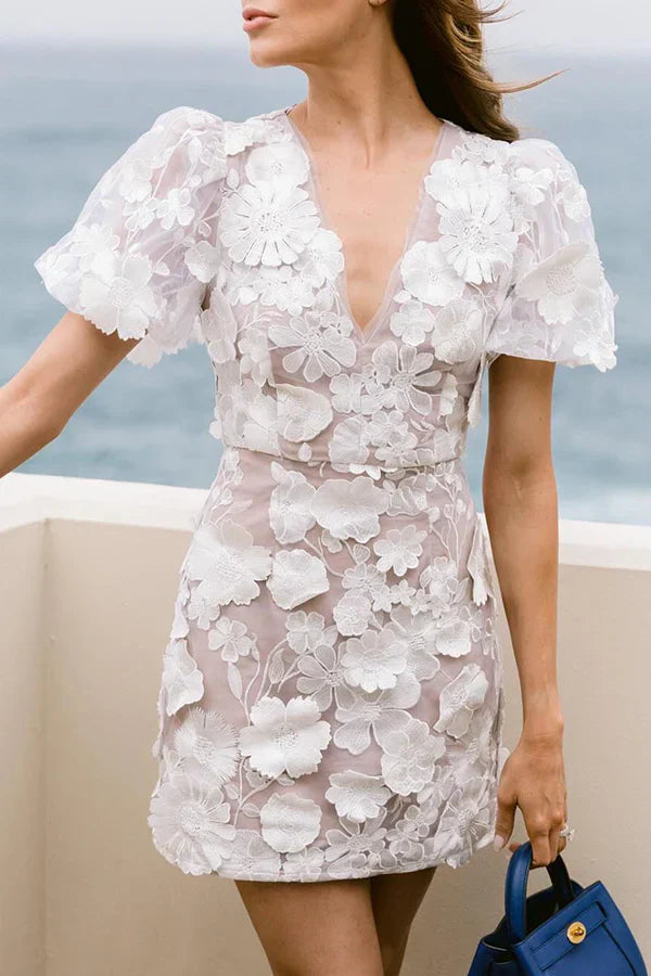 Chic women's floral puff sleeve mini dress. Ideal for summer casual outings or elegant party wear. Feminine style.
