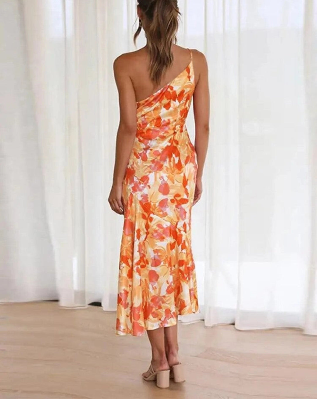 Elegant women's one-shoulder floral midi dress, a chic wedding guest or special occasion choice.
