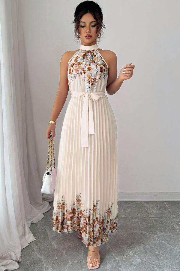 Spring collection women's floral dress, midi length, with elegant pleats and a striking square neck.