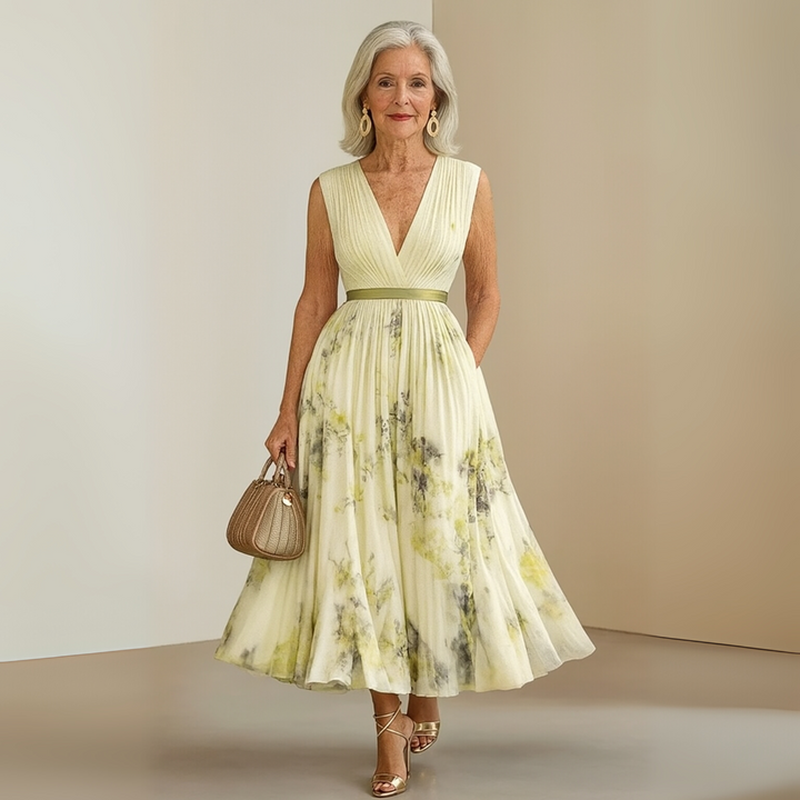 Modern women's floral pleated midi dress with a flattering V-neck, an elegant summer choice.