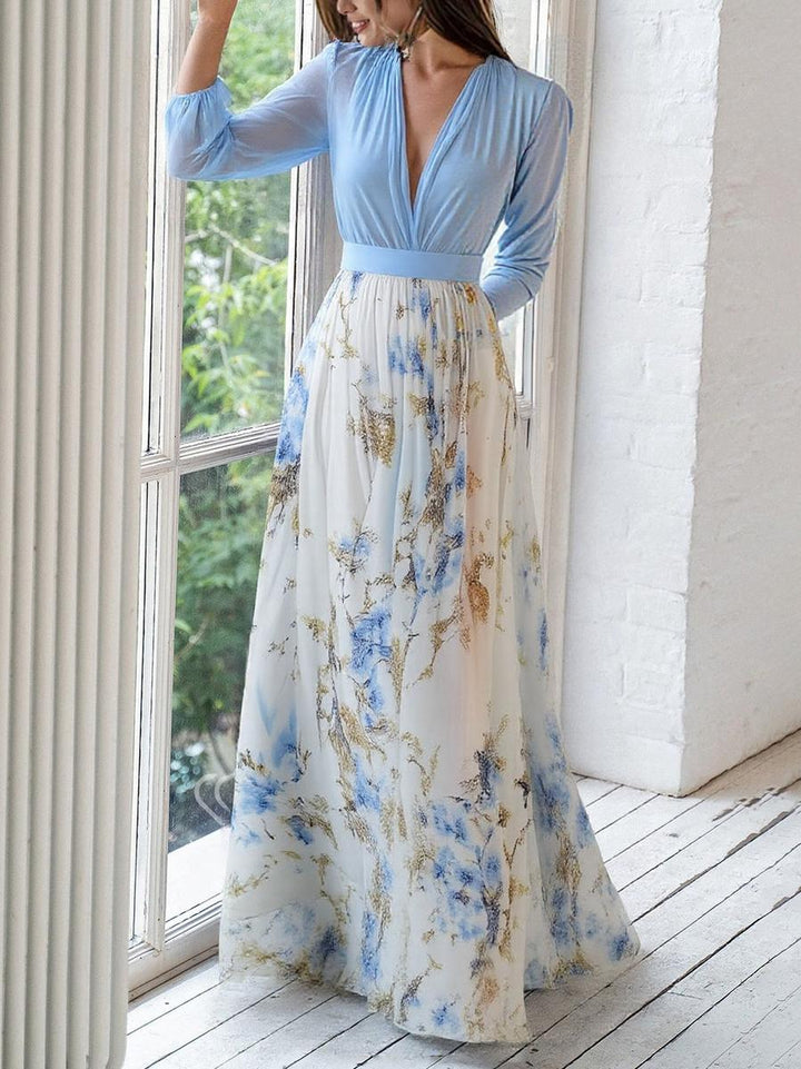 Stylish women's V-neck maxi dress with a vibrant floral print and flowing fabric, great for casual summer wear.