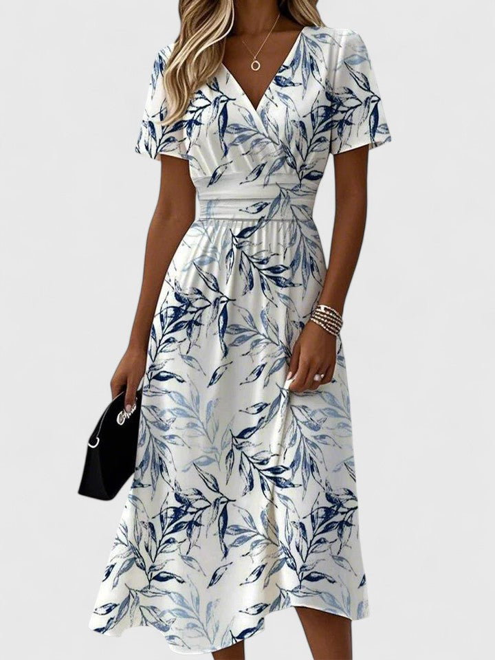 Elegant women's floral print midi dress with wrap V-neck & flutter sleeves. Perfect for spring & summer occasions.