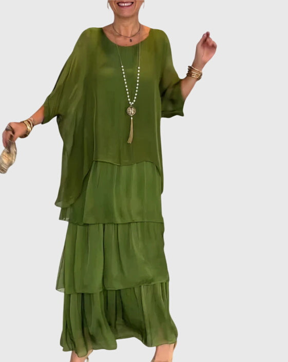 Long elegant formal dress for women, relaxed fit, flowing fabric, button-up front, special occasion.