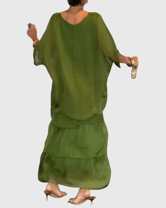 Formal women's button-up maxi dress, elegant & flowing, suitable for special events.