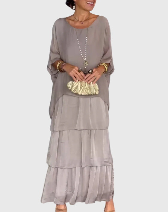 Women's relaxed fit long dress, flowing silhouette, button-up and collared for formal occasions.