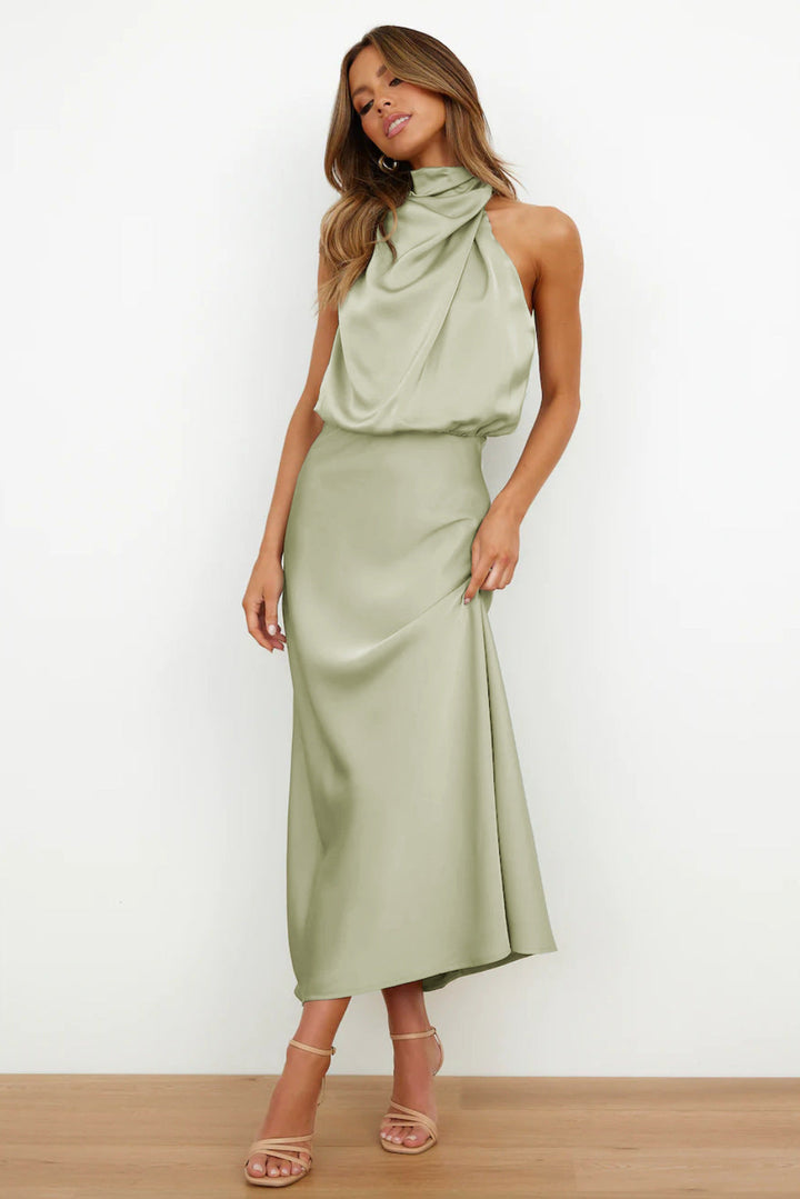 Sophisticated women's halter long dress, open back, flowing design for special occasion & party wear.