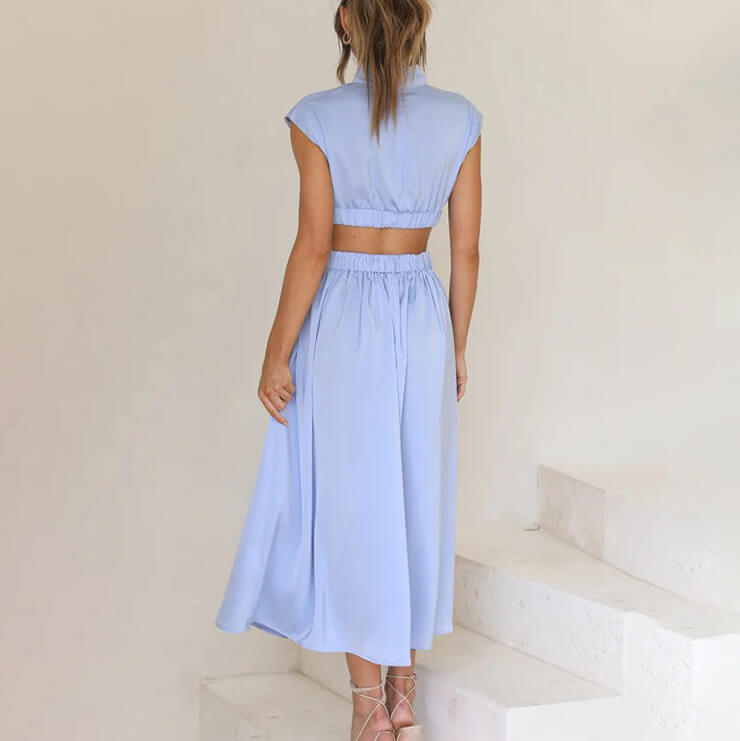 Trendy women's midi halter dress, ideal for versatile summer and spring styling, features a chic side slit.