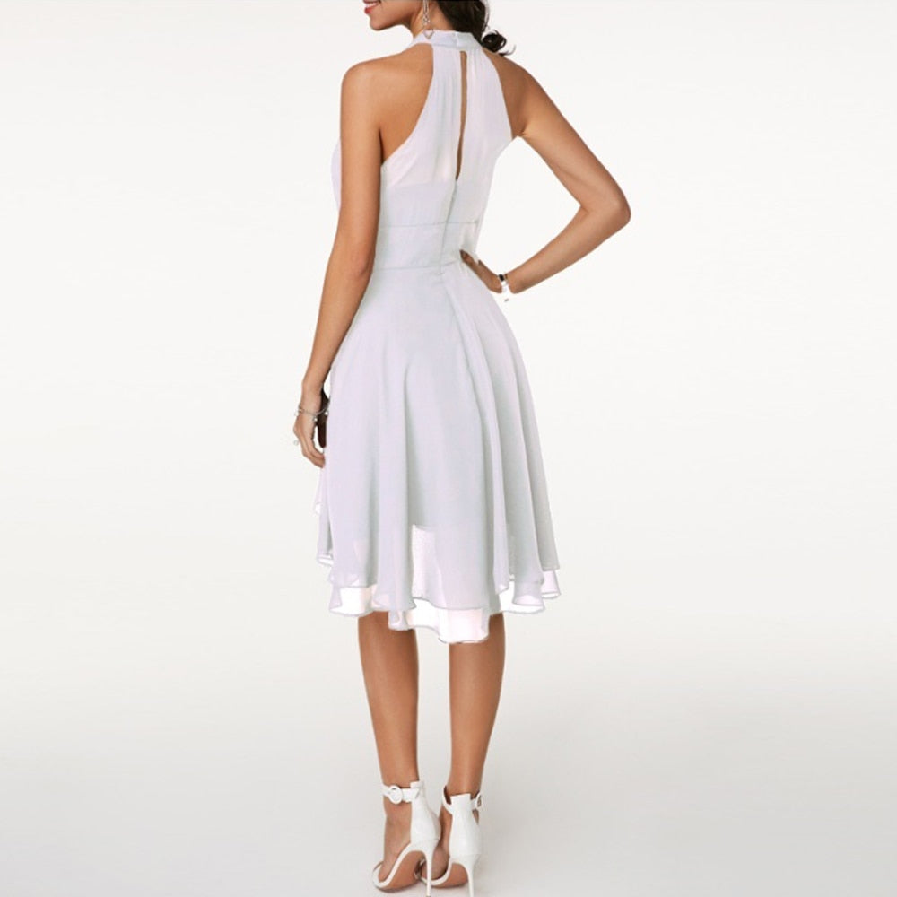 Chic halter mini dress for women, featuring an elegant fluid drape, ideal for parties & special occasions.