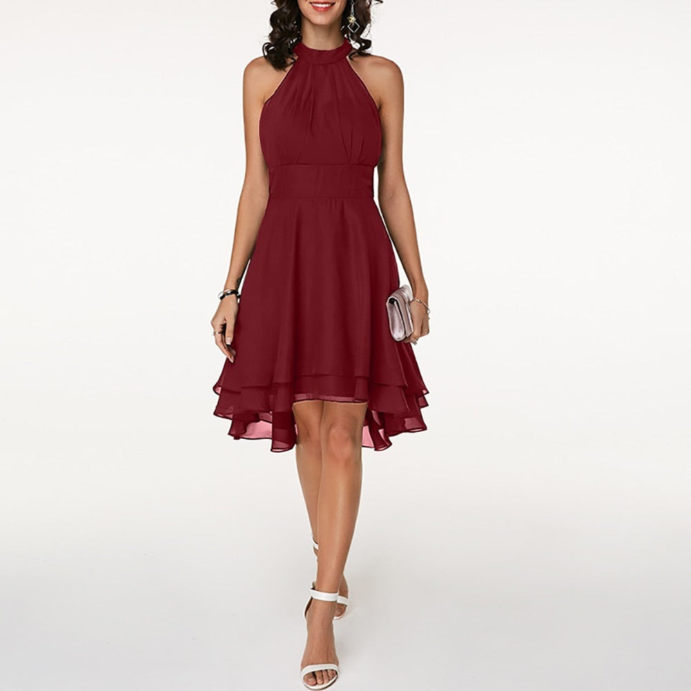Women's elegant halter mini dress with a sleeveless design & fluid drape, suitable for evening & party fashion.