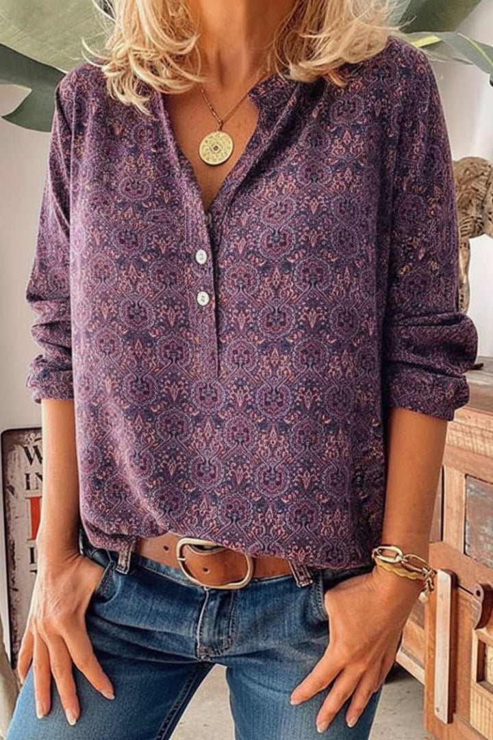 Relaxed fit women's button blouse, long sleeve. Features an elegant vintage print for versatile style.