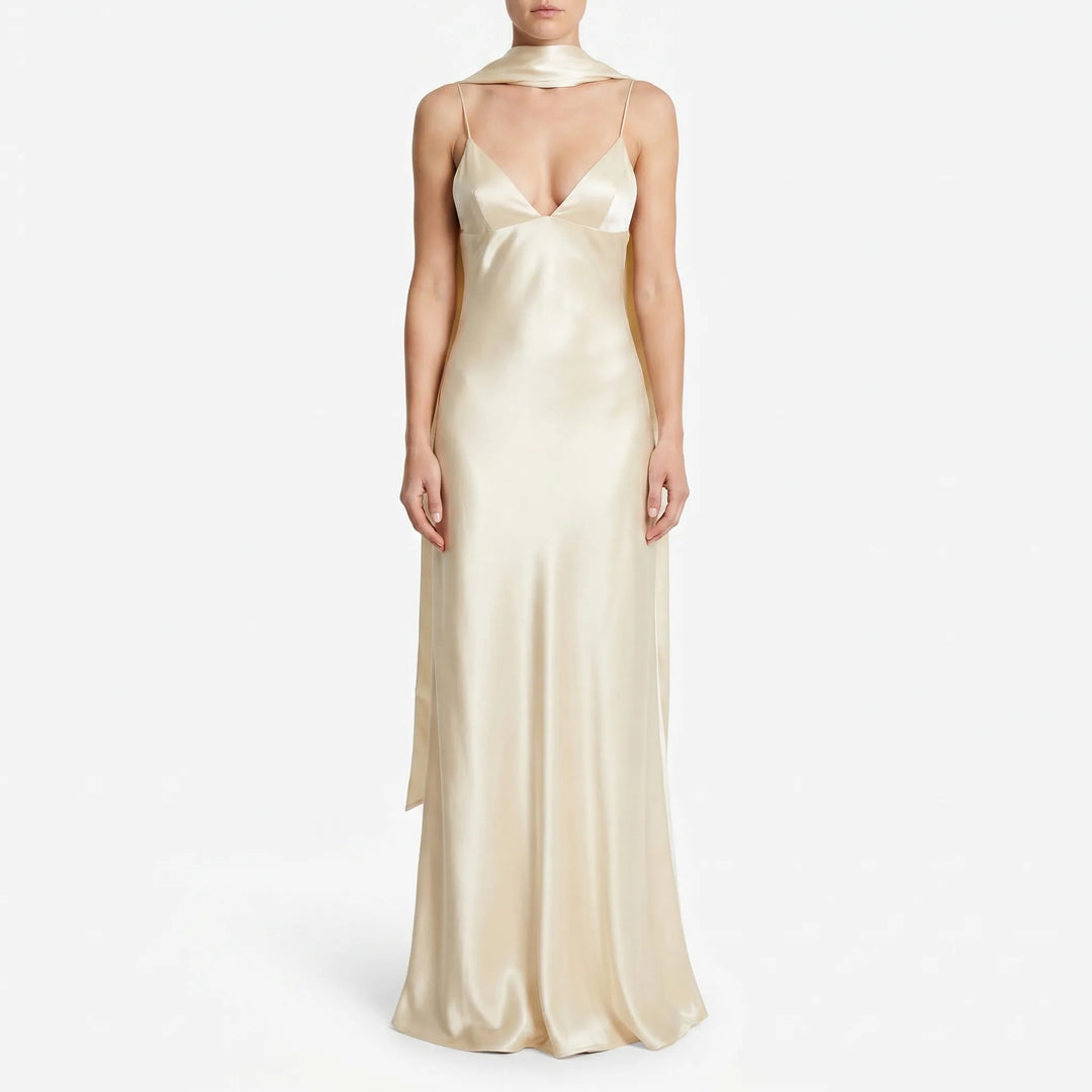 Stylish backless slip dress for women, featuring a V-neck and elegant scarf detail, ideal for formal party wear.