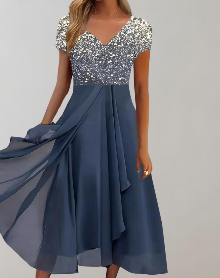 Stylish women's elegant midi dress, perfect for a glamorous cocktail party. Features delicate floral embellishments.