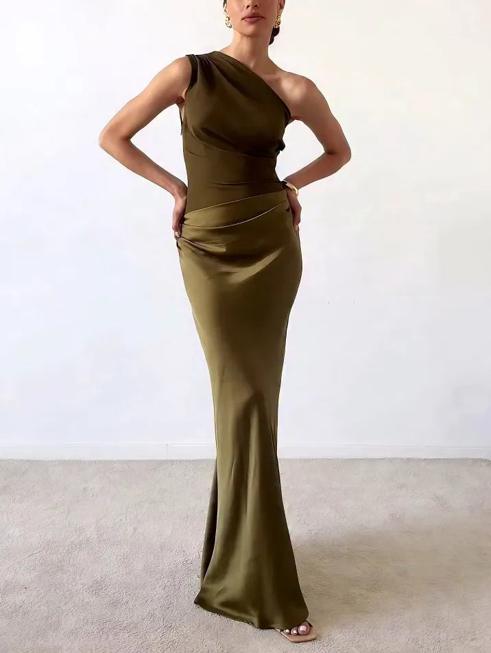 Floor-length pleated one-shoulder gown for women, ideal as a wedding guest or special occasion dress.