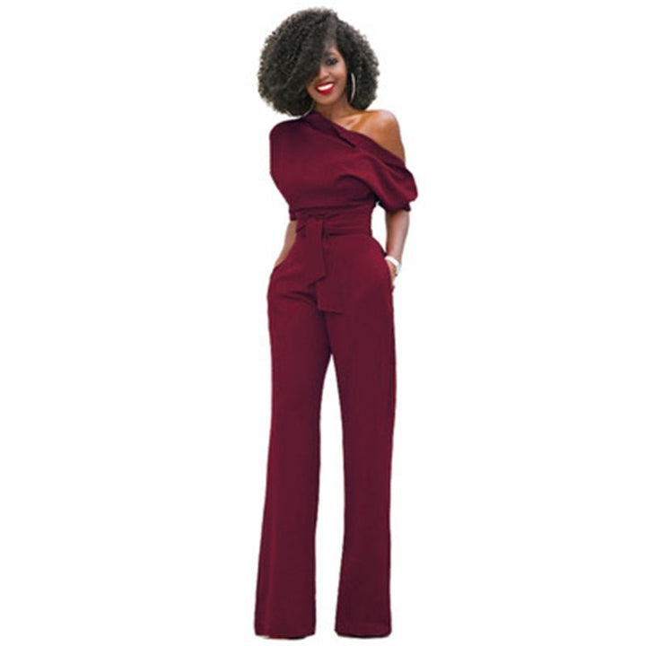 Women's elegant one-shoulder wide-leg jumpsuit styled for a formal event. Perfect party or evening wear fashion.