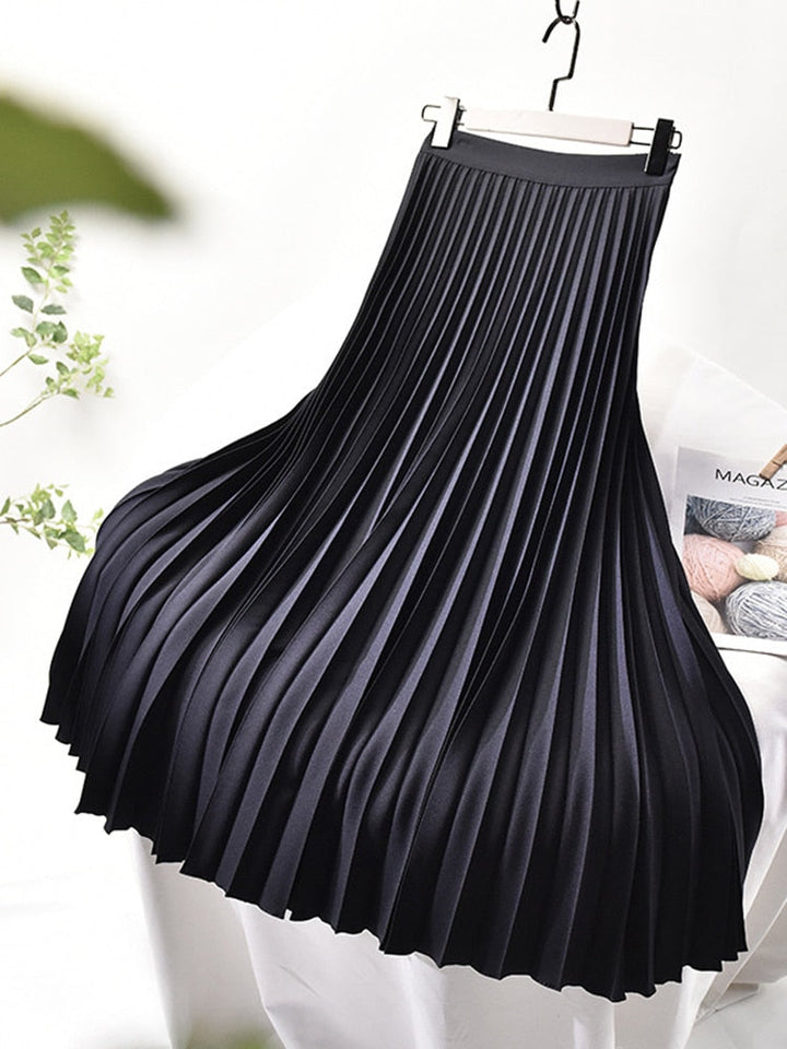 Fashion-forward women's elegant pleated midi skirt. High waist design, perfect for a sophisticated look.