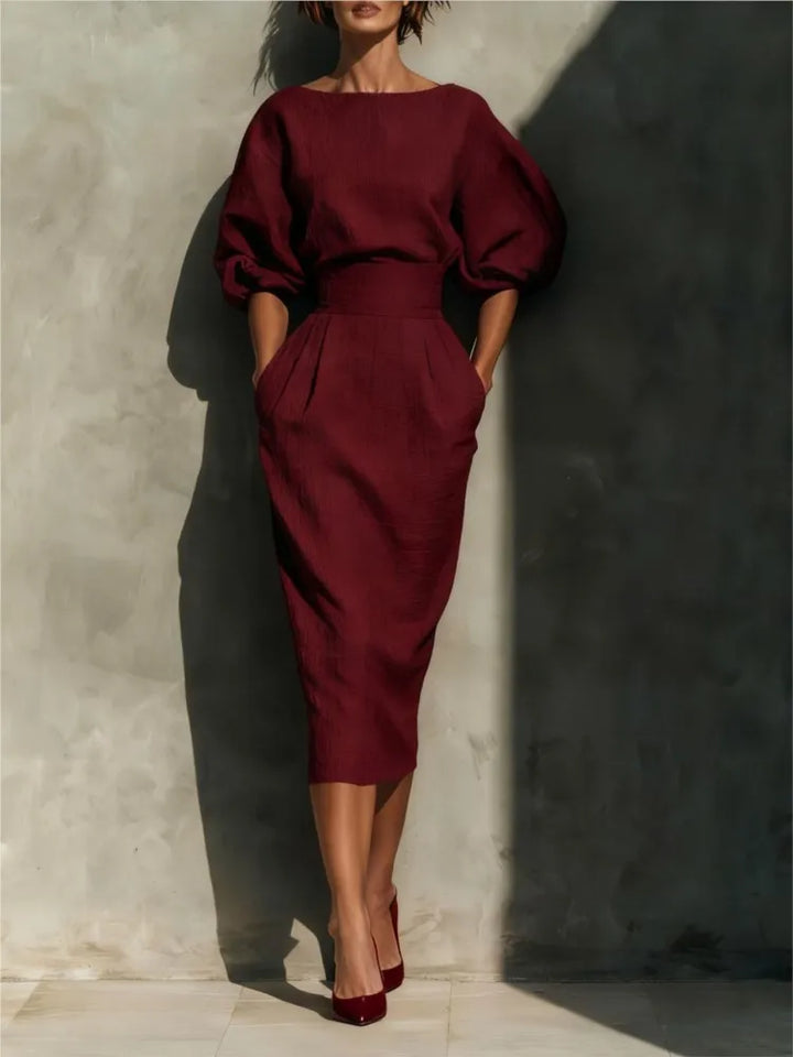 Sophisticated women's midi dress featuring lantern sleeves, delicate pleats & a flattering cinched waist silhouette.