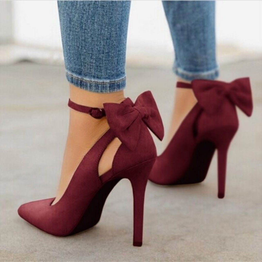 Elegant women's pointed toe high heel court shoes with a delicate bow, perfect for formal events.