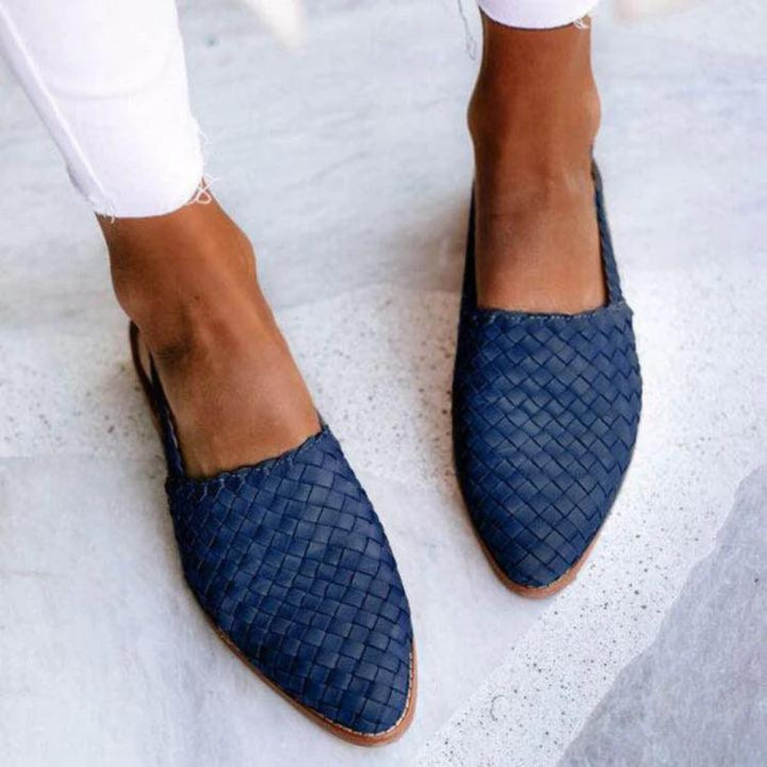 Fashionable women's slip-on backless woven mules. Pointed toe loafers ideal for office wear or chic casual outfits.