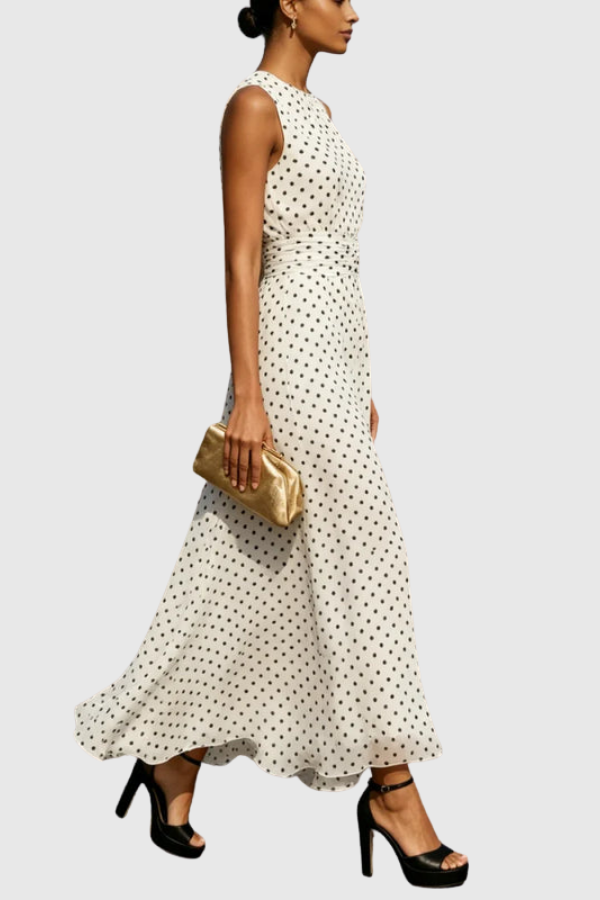 Flowy women's polka dot halter maxi dress featuring a keyhole neckline, perfect for sophisticated summer outings.