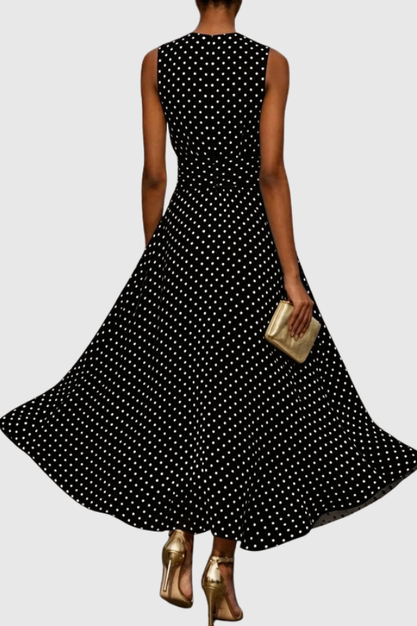 Versatile polka dot halter neck maxi dress with an elegant keyhole, suitable for parties or resort wear.