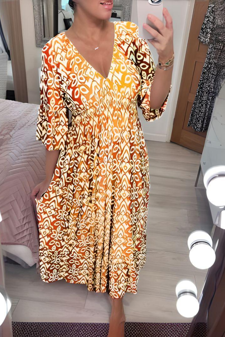 Elegant women's printed midi dress with a defined waist, perfect for spring occasions.