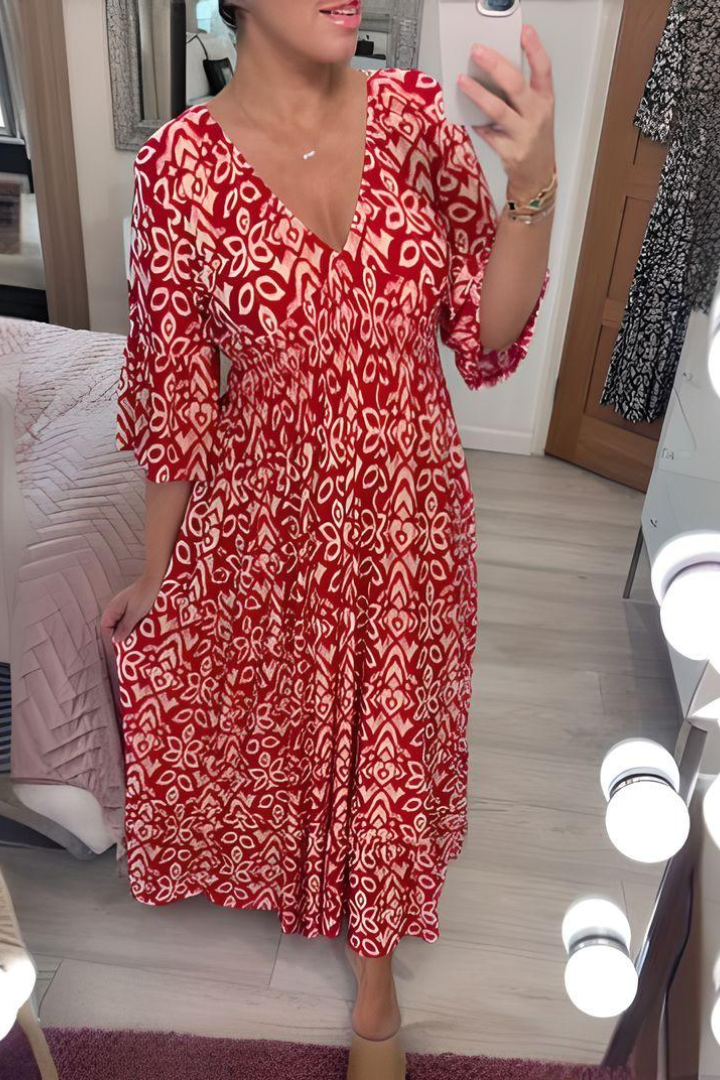 Chic women's spring occasion dress; a printed midi with an elegant design and defined waist.
