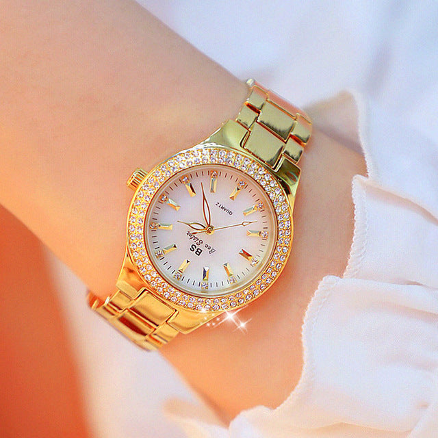 Stylish women's quartz wristwatch, durable stainless steel with glossy finish. Water-resistant, classy accessory.