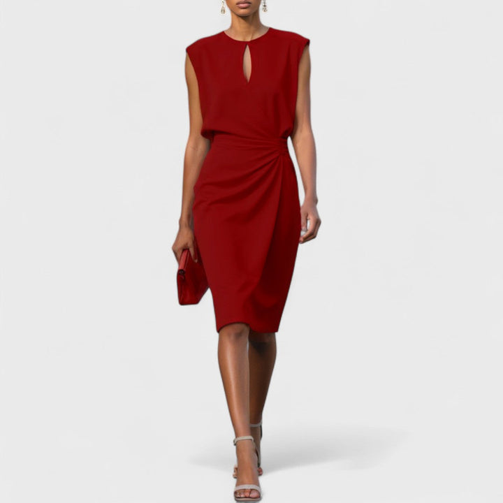 Fashionable women's sleeveless midi dress with unique cutout detail and elegant pleated drape. Modern event wear.