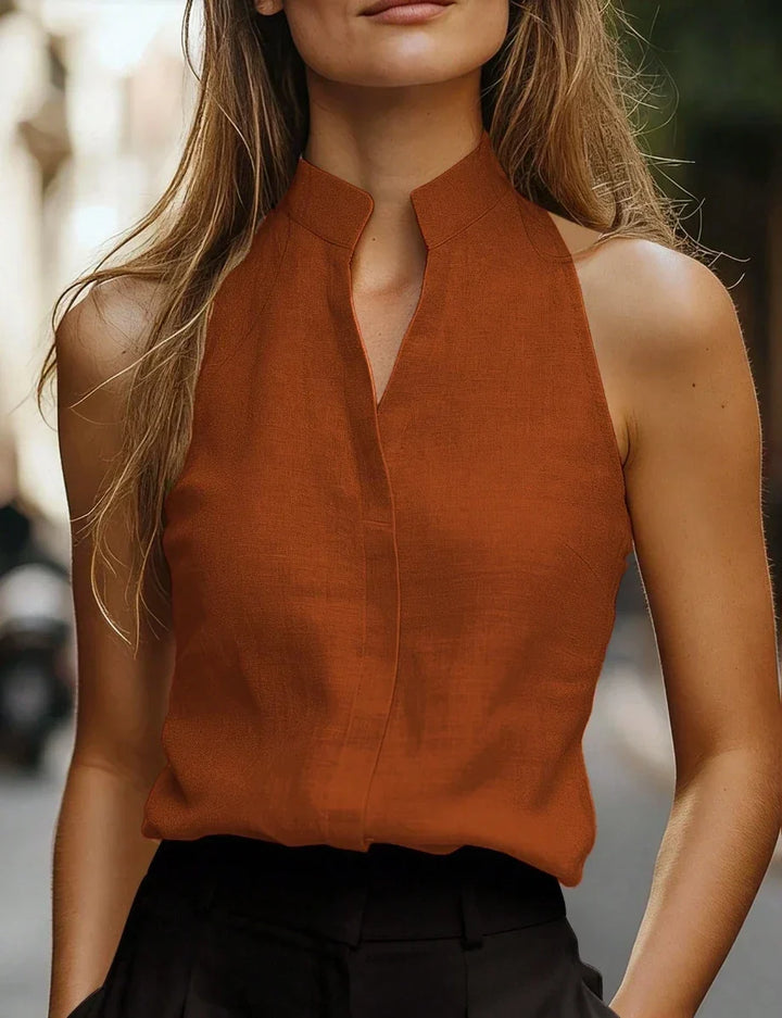 Elegant women's sleeveless mock neck blouse, perfect for summer chic and everyday comfort.