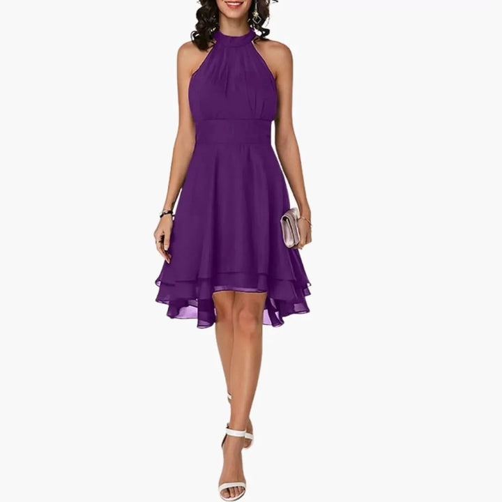 Chic women's sleeveless dress with ruffle detail, round neck, knee-length, ideal for elegant summer outfits.