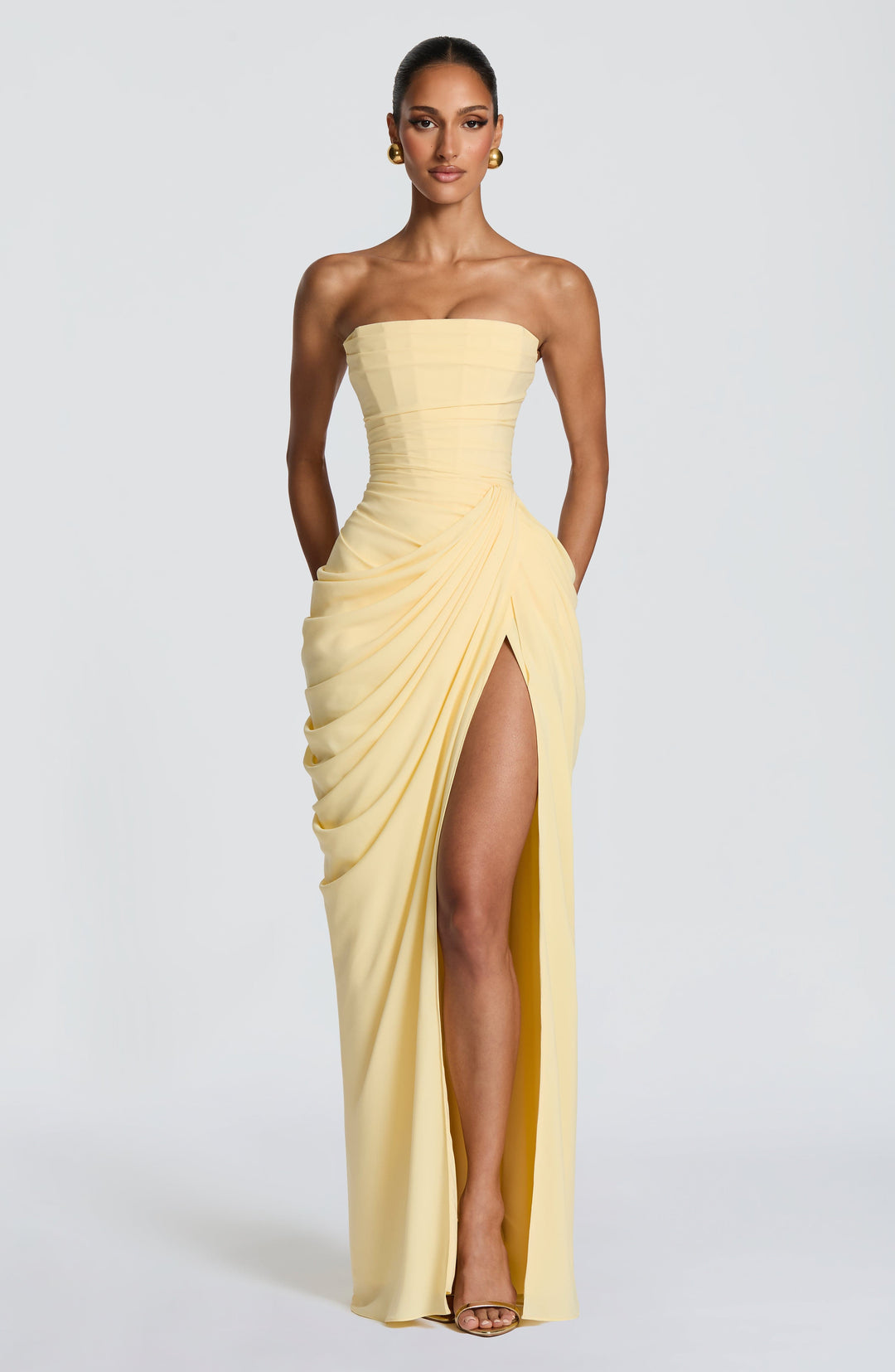 Elegant women's strapless corset maxi dress with high slit & lace-up back, perfect for formal evening events.