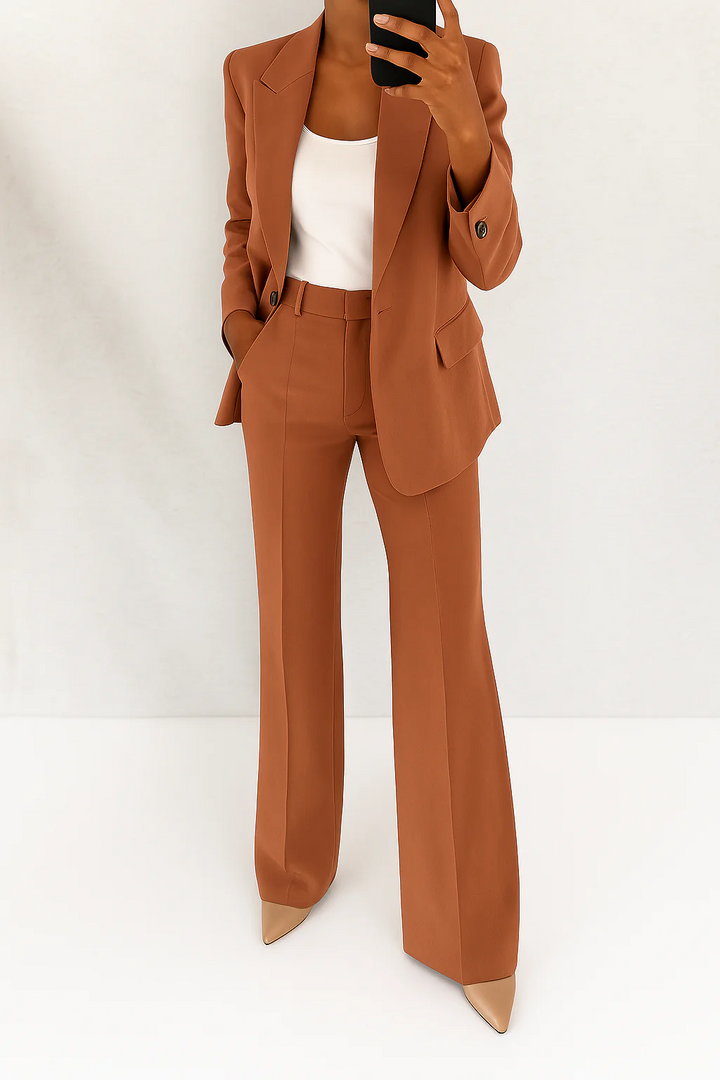 Modern women's elegant suit: a sophisticated blazer paired with comfortable wide-leg pants, perfect for work.