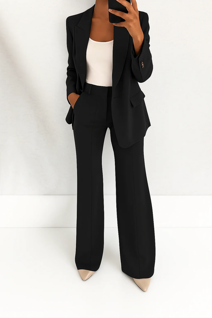Full body shot of a woman in an elegant two-piece blazer & wide-leg pant suit, perfect for office or formal events.