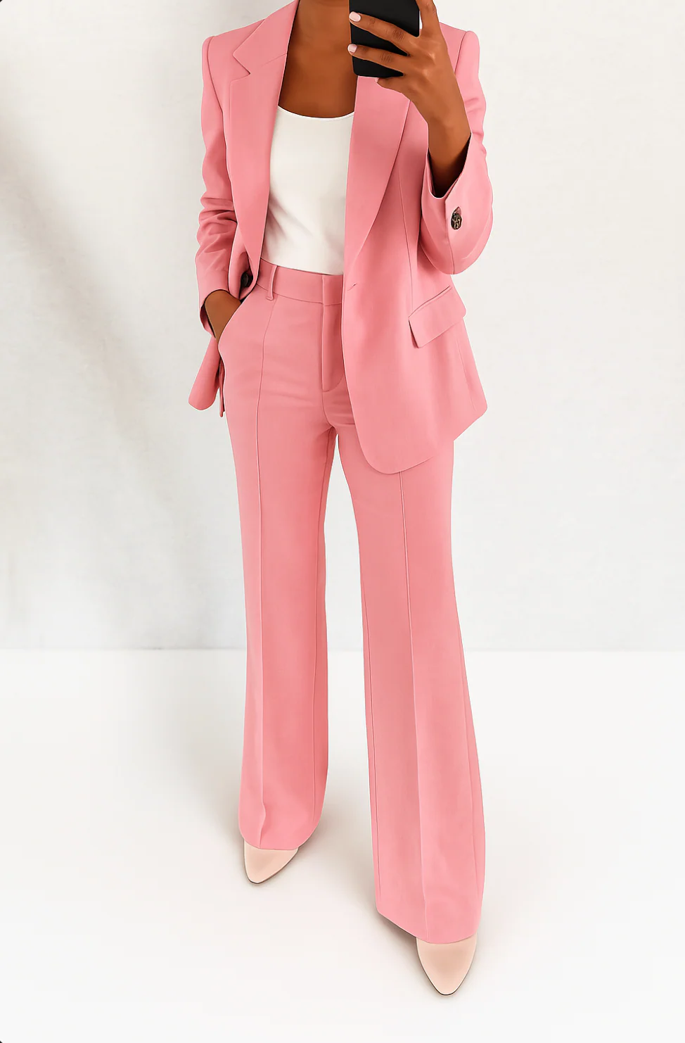 Elegant women's business suit: chic blazer and flowing wide-leg pants, a sophisticated two-piece office outfit.