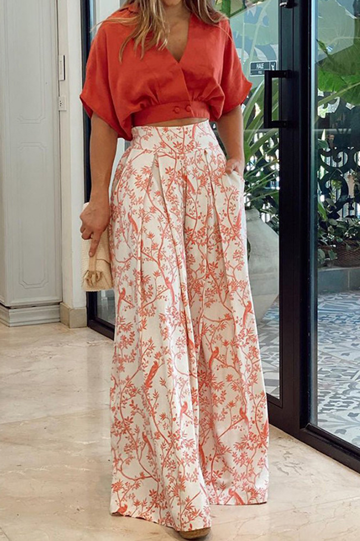 Stylish women's matching set with V-neck top and wide leg pants, ideal for vacation, garden parties & summer.