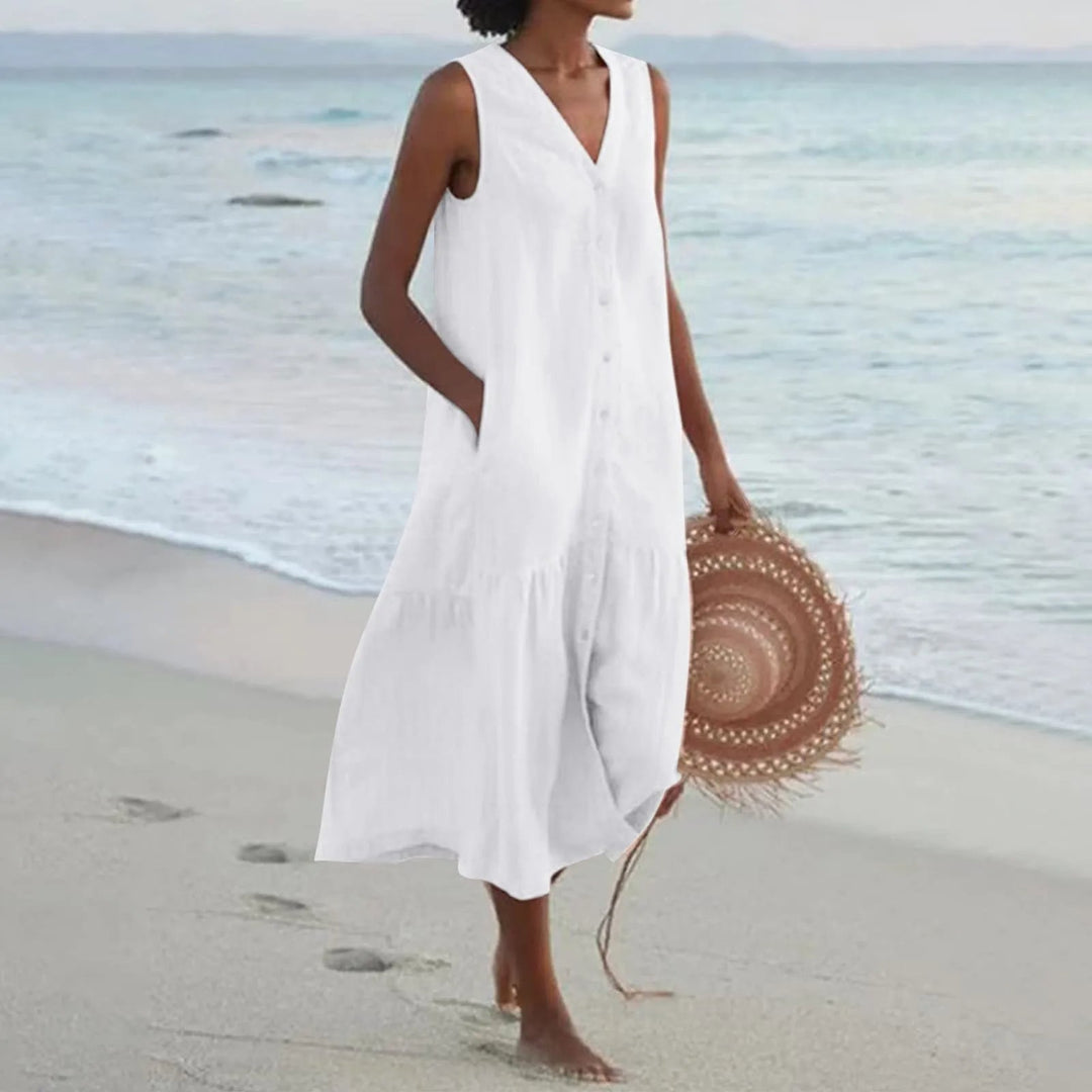 Elegant women's V-neck flowy midi sundress with button front, perfect for summer casual or vacation style.