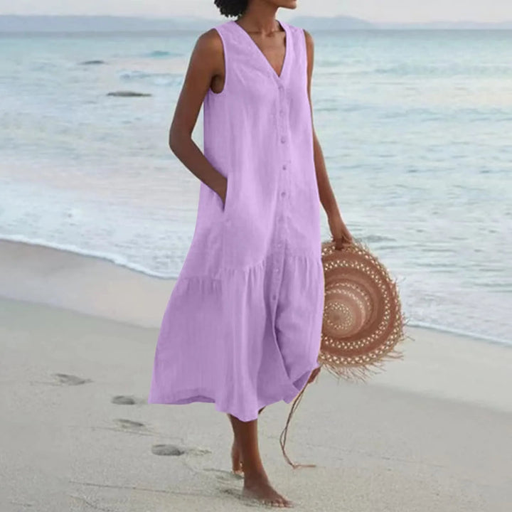 Versatile women's midi sundress with elegant V-neck and flowy button-front design for summer casual wear.
