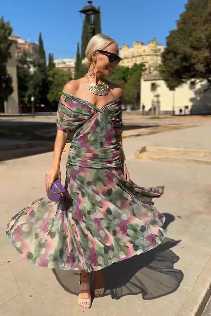 Close-up of elegant V-neck & flutter sleeves on a women's maxi dress, highlighting detailed design.