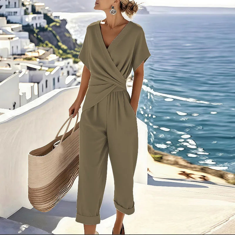 Women's chic wrap-style cropped jumpsuit. An elegant one-piece outfit for summer, travel, or sophisticated casual looks.