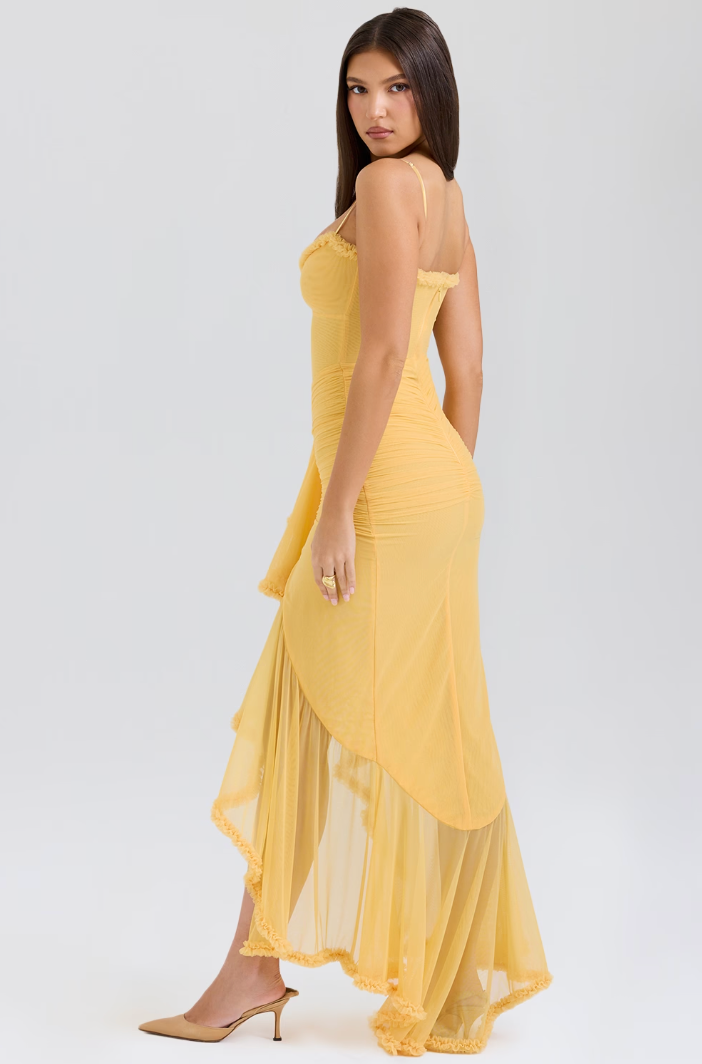 Flattering yellow ruched midi dress, an elegant and versatile choice for women.