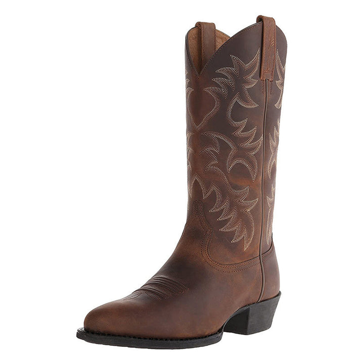 Elegante Cowboy-Stiefel aus hochwertigem Leder mit spitzen Zehenkappen, markanten Nähten; ideal für verschiedene Anlässe.