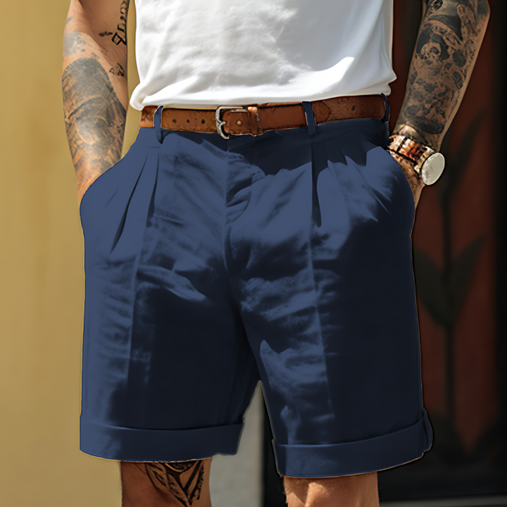 "Elegante Herrenshorts aus Baumwolle, locker geschnitten, mit Knopfleiste und Taschen, ideal für Freizeit und Büro."