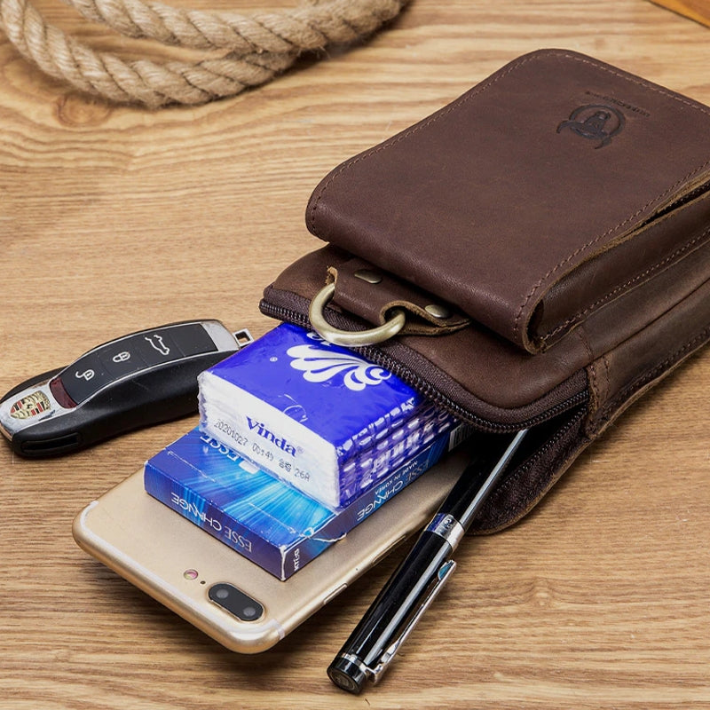 "Elegante Ledergürteltasche, passt für 7-Zoll Smartphones, aus robustem braunem Rindsleder mit Gürtelbefestigung."