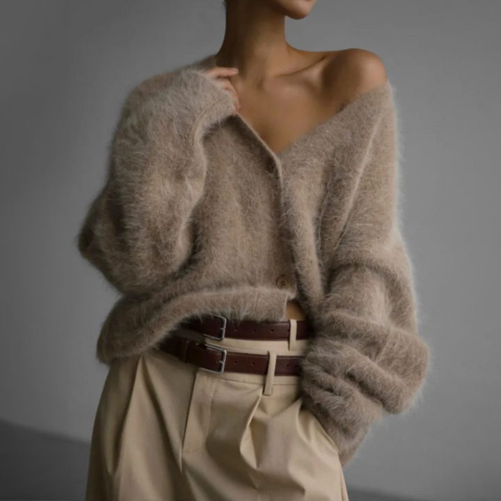 Elegante, oversize Kaschmir-Weste mit V-Ausschnitt in Beige. Weich, komfortabel, und vielseitig kombinierbar für Damen.