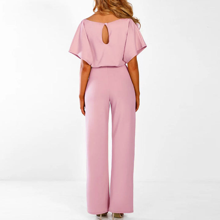 "Eleganter Damen Jumpsuit in Beige, Schwarz und Pink, mit Gürtel und fließender Silhouette, ideal für Sommer."