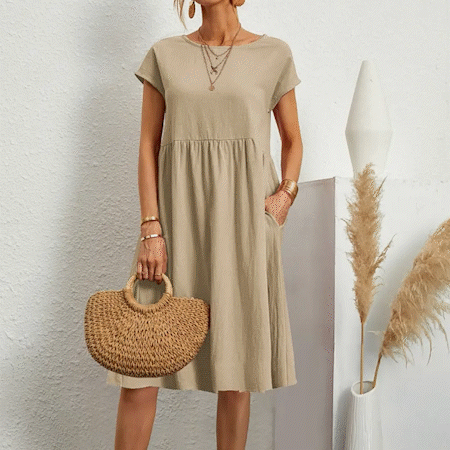 "Elegantes Damen-Sommerkleid mit Empire-Silhouette, kurze Ärmel, luftiger Rock, ideal für warme Tage, vielseitiger Stil."