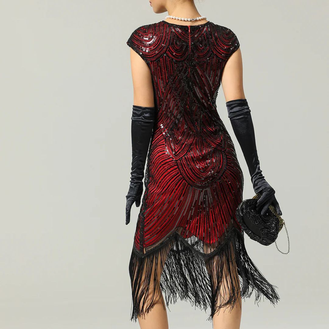 Elegantes Glitzerkleid Gatsby-Style mit funkelnden Pailletten und Fransen, figurbetont, in Burgund, Gold und mehr.