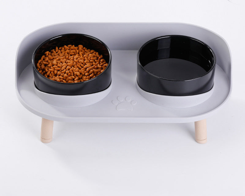 White ceramic pet bowls in a modern elevated stand, designed for comfortable feeding of small to medium dogs