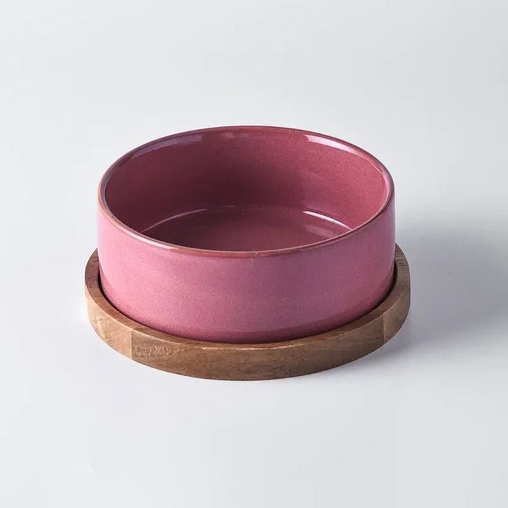 Complete set: an ergonomic ceramic pet bowl paired with a solid wooden stand for easy feeding.
